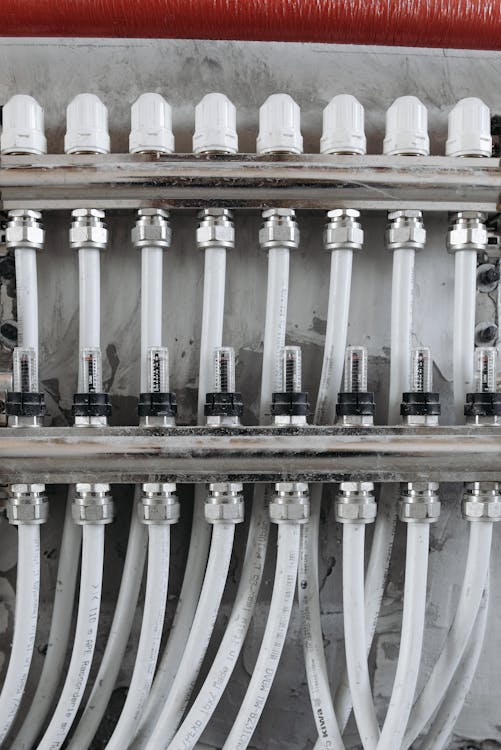 Close-up of white pipes on wall